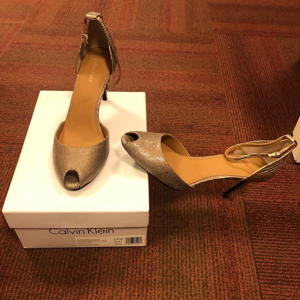 Golden Calvin Klein Peep Toes.